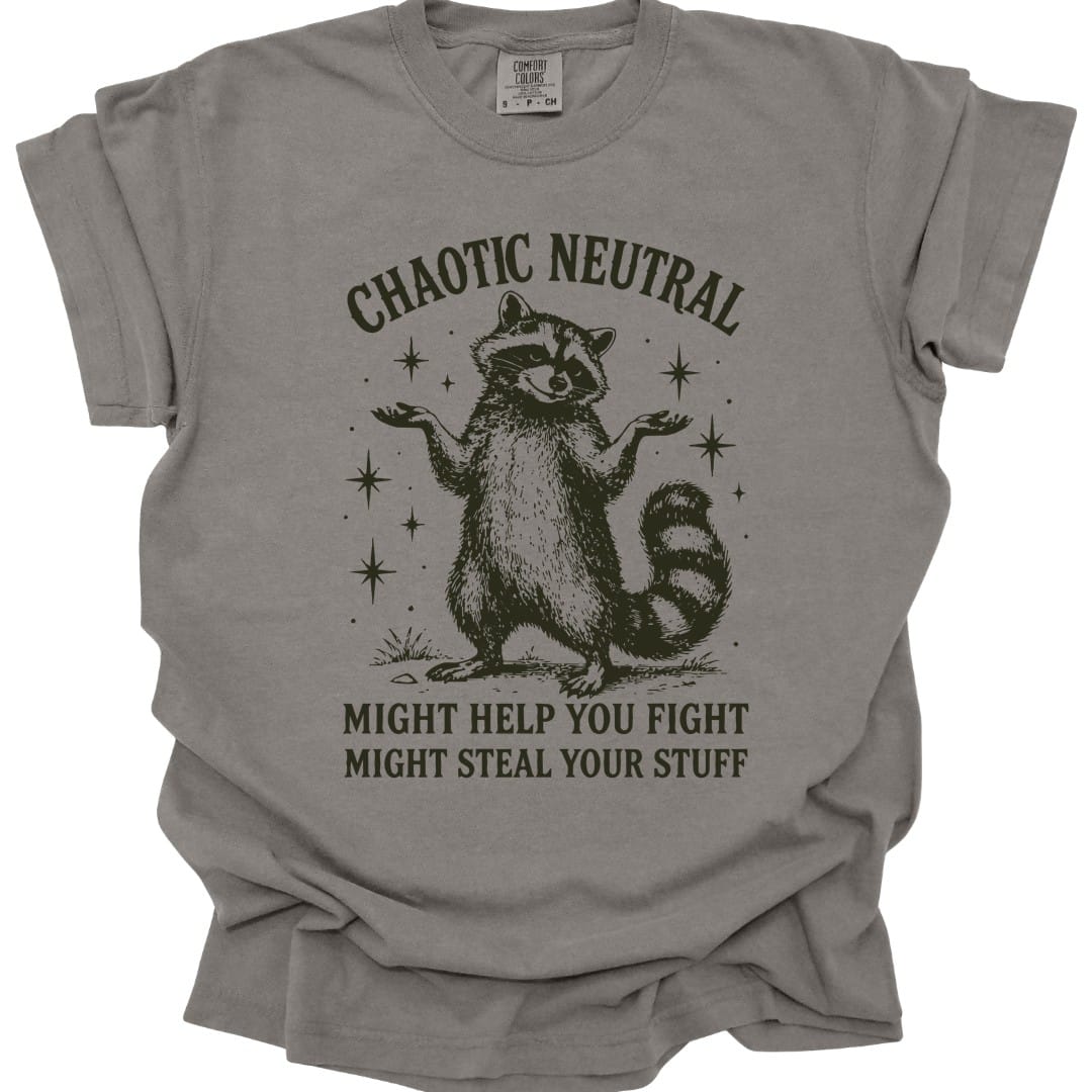 The same Chaotic Neutral raccoon design, on a grey t-shirt.