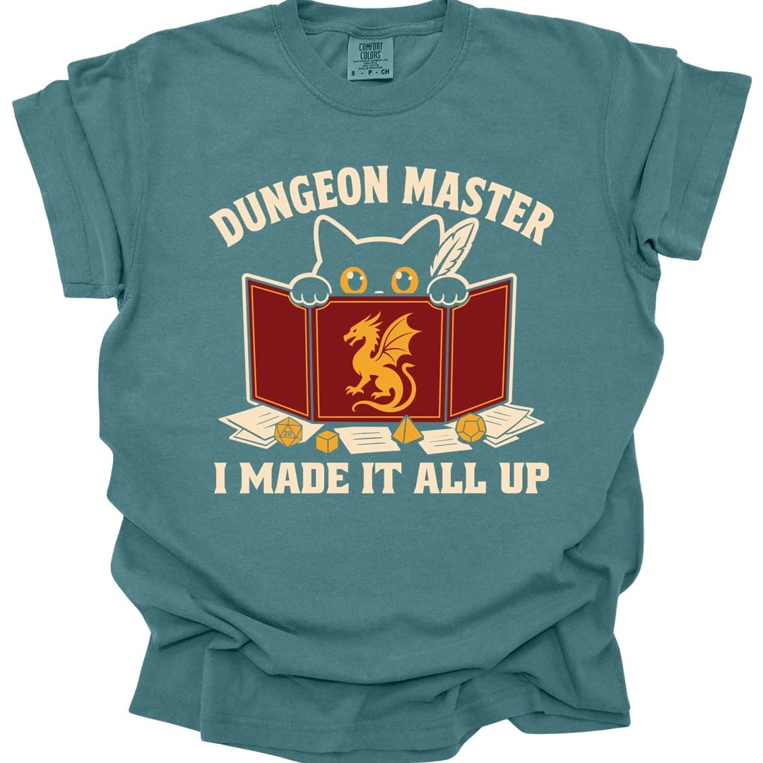 The same Dungeon Master cat behind screen design, on a blue spruce t-shirt.