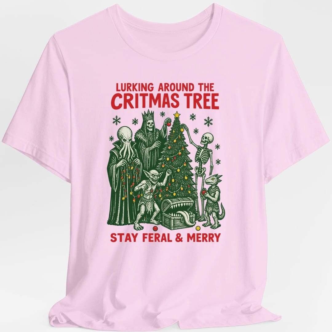 The same Lurking Around the Critmas Tree design, on a light pink t-shirt.