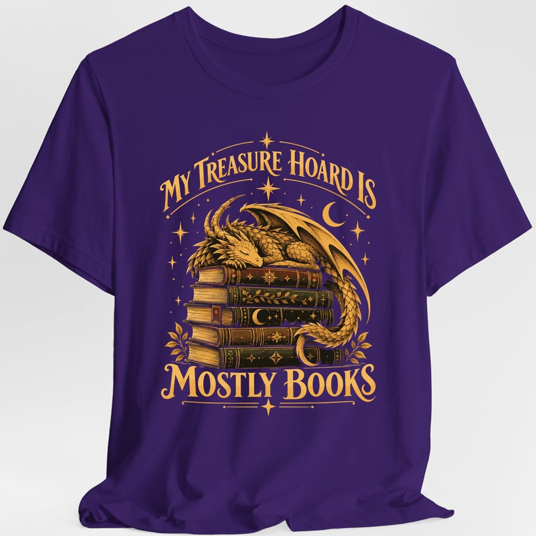 The same Treasure Hoard Mostly Books dragon design, on a purple t-shirt.