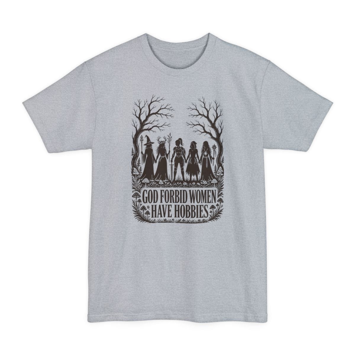 Light Steel tall t-shirt. The design reads "God Forbid Women Have Hobbies" in bold serif capitals across two lines at the bottom. Above the words five women adventurers stand in silhouette holding hands in a row, a wizard with a staff, a druid crowned with antlers, a knight in armor with a sword, a hooded ranger with daggers, and a sorcerer with an orb topped staff. Bare trees arch overhead and mushrooms and ferns crowd the ground. Cut paper silhouette art in one dark brown ink.