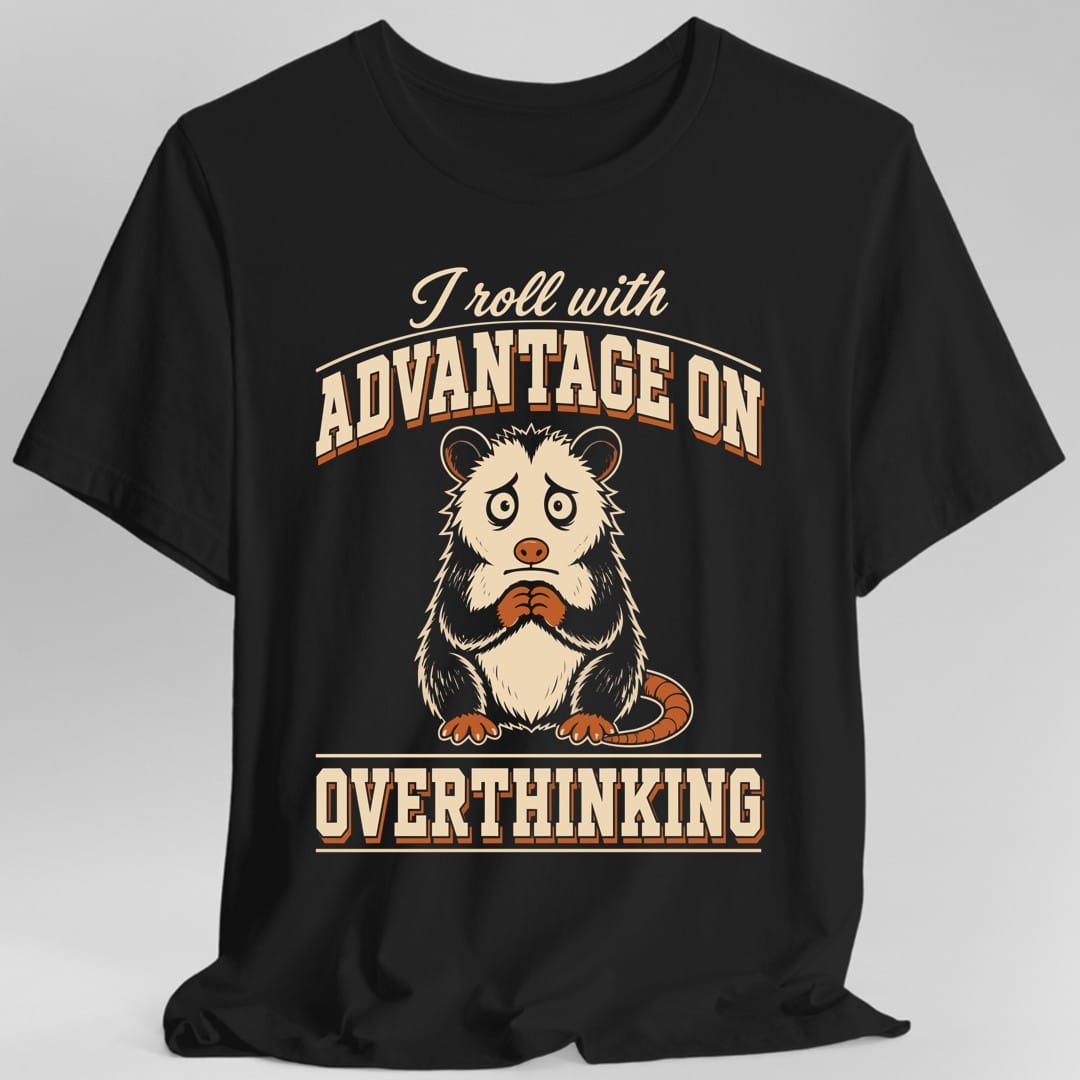 Black t-shirt. The design reads I roll with in cream script across the top, then ADVANTAGE ON in large arched collegiate capitals with a rust drop shadow, and OVERTHINKING in matching capitals below a cream rule at the bottom. Between the lines of text sits a wide eyed opossum with raised eyebrows and clasped front paws, its ringed tail curled around to one side. Cream and rust on a plain background.