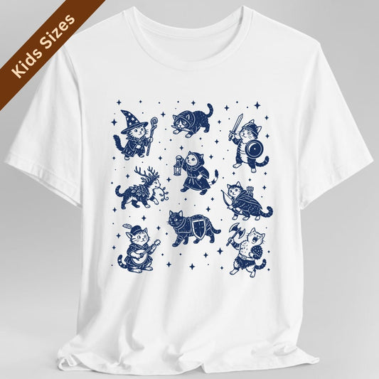White kids t-shirt. No words. Nine cats dressed as fantasy adventurers are arranged in three rows among small four-pointed stars. Among them a wizard cat in a starry pointed hat with a staff, a cat in a hood carrying a lantern, a knight cat with a sword and round shield, an archer cat with a bow and quiver, a bard cat in a feathered cap playing a lute, an antlered cat trailing leafy vines, an armored cat with a shield, and a shaggy cat swinging an axe. Woodcut style line art in a single deep navy ink.