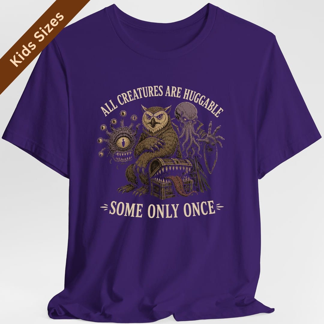 The same All Creatures Huggable design, on a purple kids t-shirt.
