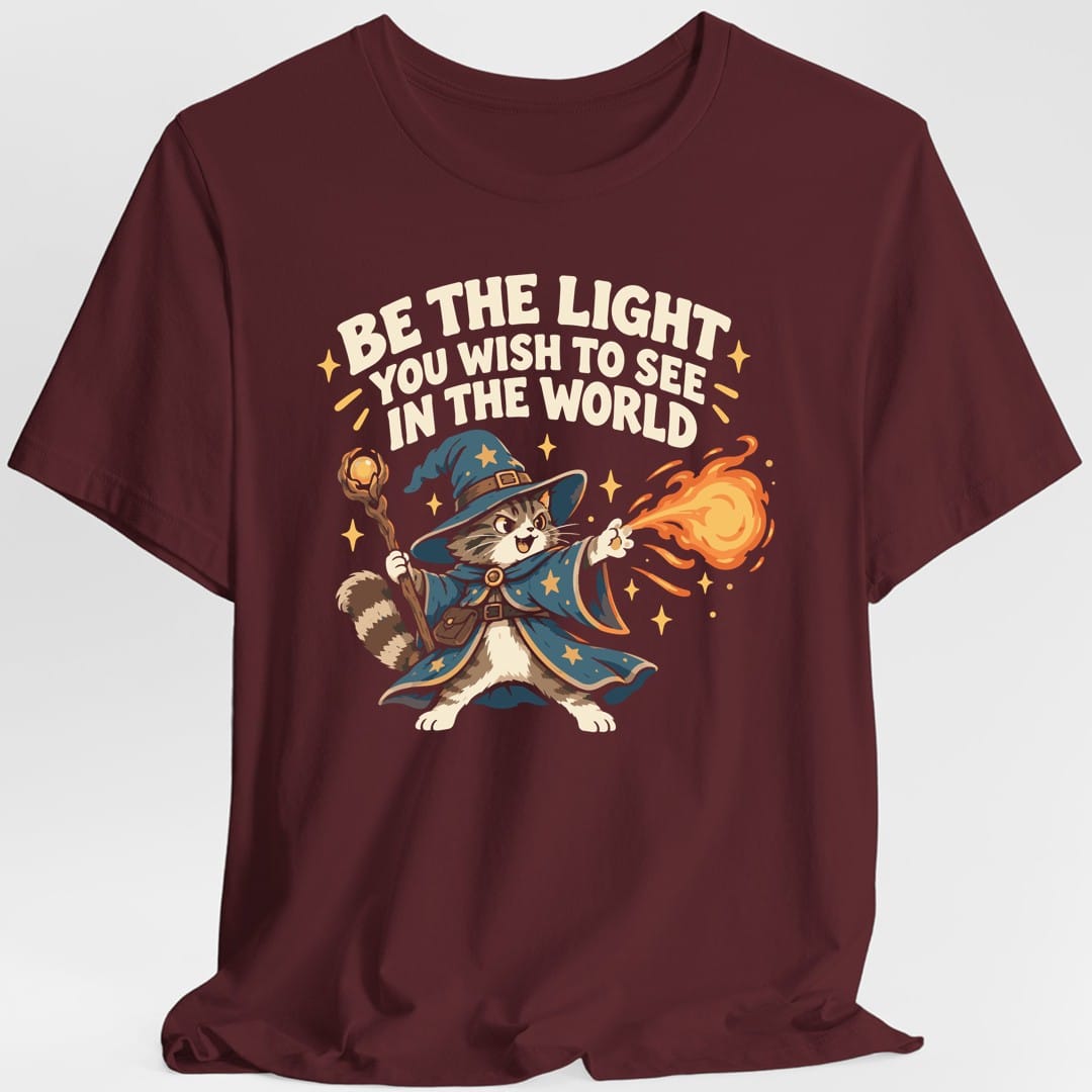 The same Be The Light wizard cat design, on a maroon t-shirt.