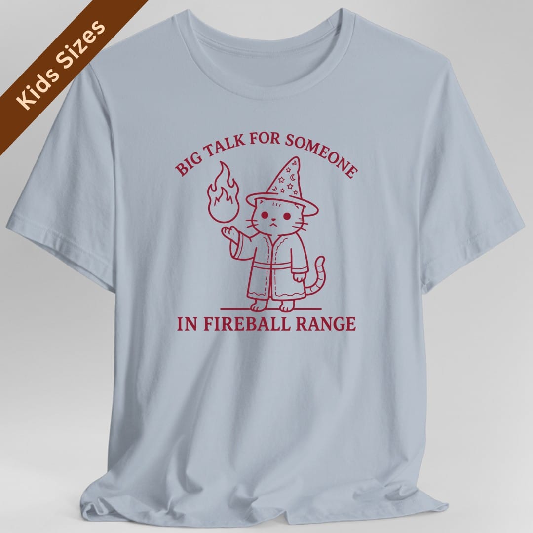 The same Big Talk for Someone in Fireball Range cat design, on a light blue kids t-shirt.