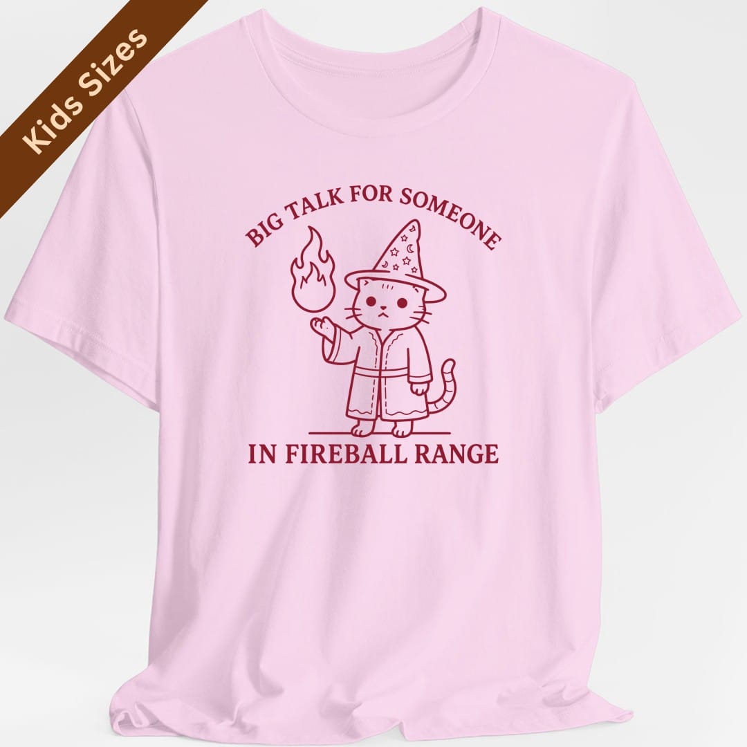 The same Big Talk for Someone in Fireball Range cat design, on a light pink kids t-shirt.