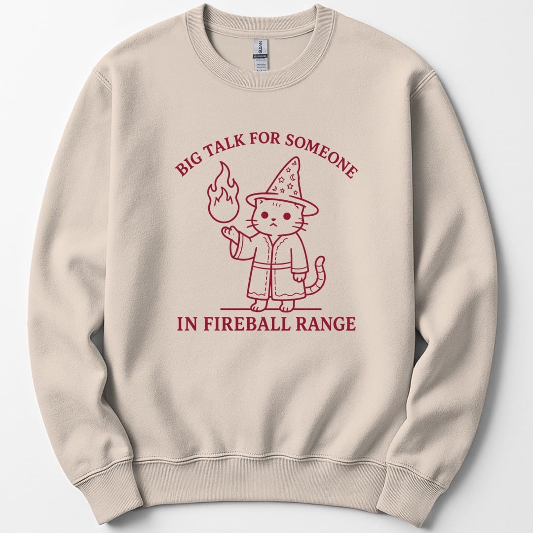 The same Big Talk for Someone in Fireball Range cat design, on a sand sweatshirt.