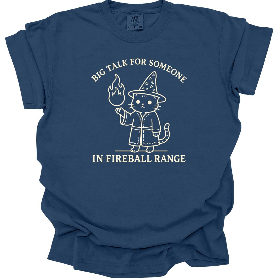 The same Big Talk for Someone in Fireball Range cat design, on a true navy t-shirt.