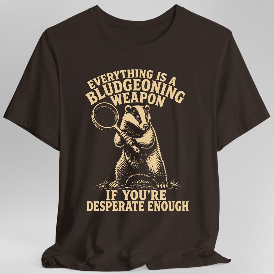 The same Bludgeoning Weapon badger design, on a dark chocolate t-shirt.