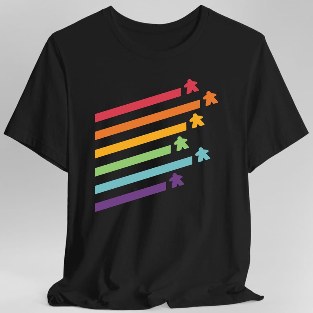 Black t-shirt. Five long diagonal stripes run across the design in rainbow colors, red, orange, green, blue and purple, each ending in a small meeple of the matching color. No words at all.