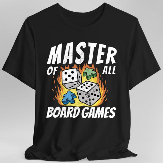 Black t-shirt. Reads "Master" across the top in large white capitals, with "of" and "all" either side of the middle, and "Board Games" across the bottom. In the middle three white dice and two meeples, one green and one blue, sit in a burst of orange flames.