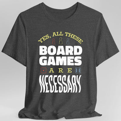 The same All These Board Games Are Necessary design, on a dark heather t-shirt.