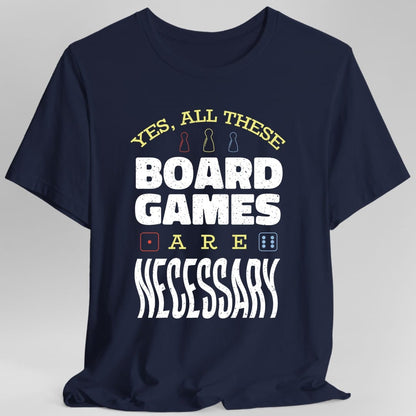 The same All These Board Games Are Necessary design, on a navy t-shirt.