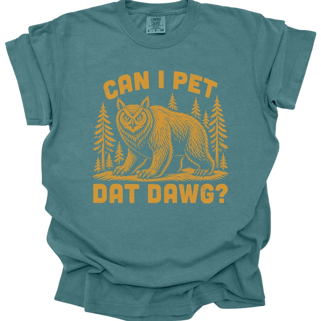The same Can I Pet Dat Dawg owlbear design, on a blue spruce t-shirt.