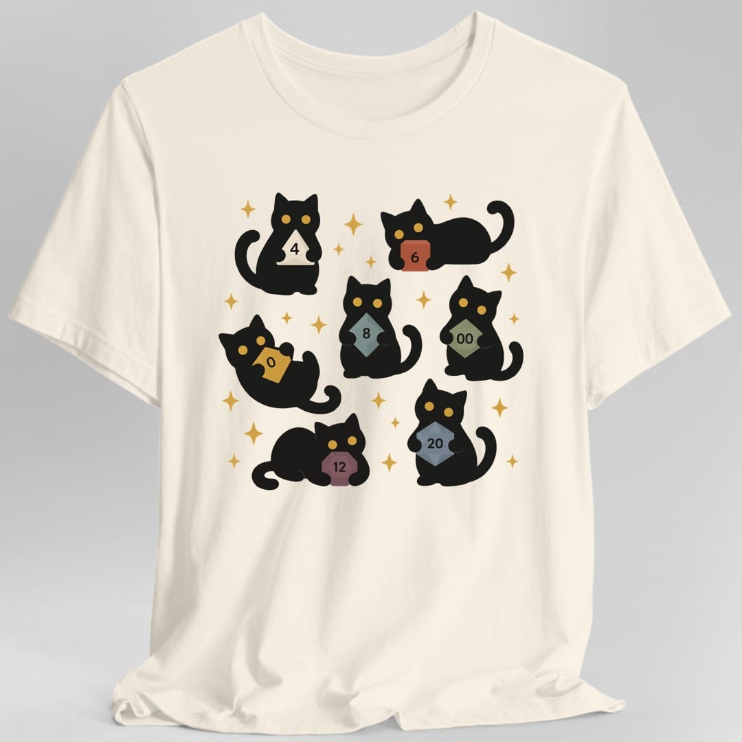 Natural t-shirt. Seven black cats with gold eyes sit and lie scattered across the design, each hugging a different polyhedral die to its chest. The dice are a cream four sided, a red six, a blue eight, a gold ten, a green percentile die marked double zero, a plum twelve and a steel blue twenty. Gold four pointed sparkles fill the gaps. Flat cartoon silhouettes, no words.