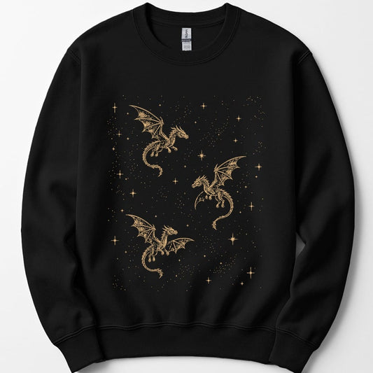 Black sweatshirt. Three long serpentine dragons drift across a night sky, drawn as thin gold constellation lines with small stars marking their joints. Tiny gold stars and specks are scattered all over the background. No words at all.