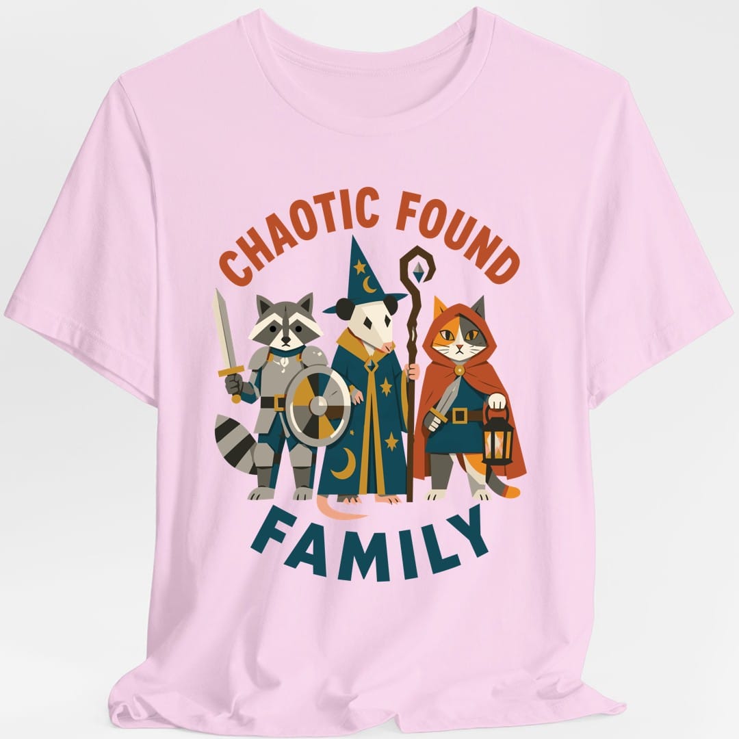 The same Chaotic Found Family design, on a light pink t-shirt.