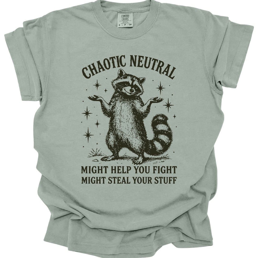 The same Chaotic Neutral raccoon design, on a bay t-shirt.