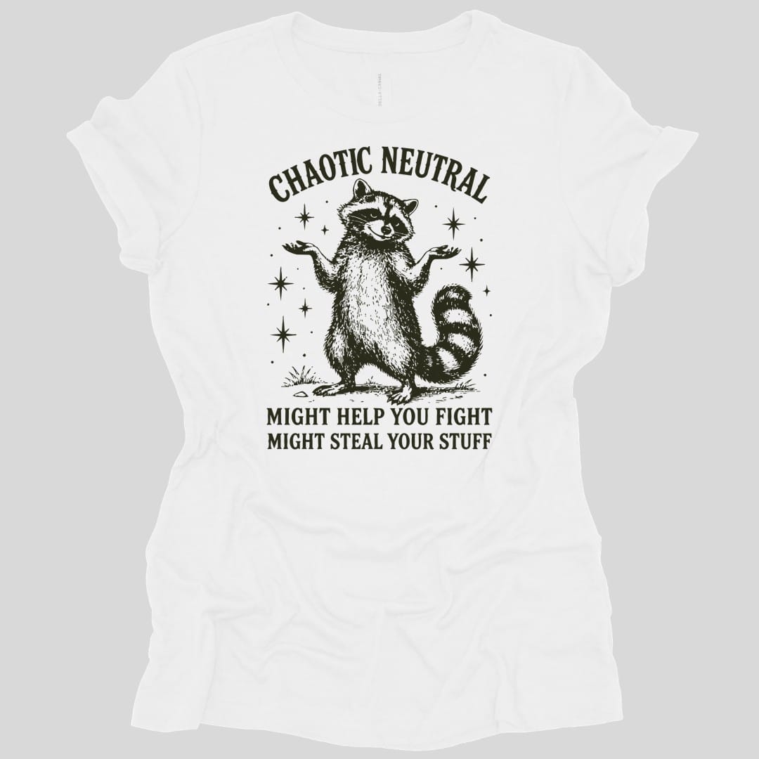White women's t-shirt. Reads "Chaotic Neutral" curving across the top in dark green capitals. Below, a raccoon stands upright with both paws spread in a shrug, drawn in fine engraving lines and ringed with sparkles. At the bottom, "Might help you fight, might steal your stuff." One dark green ink.