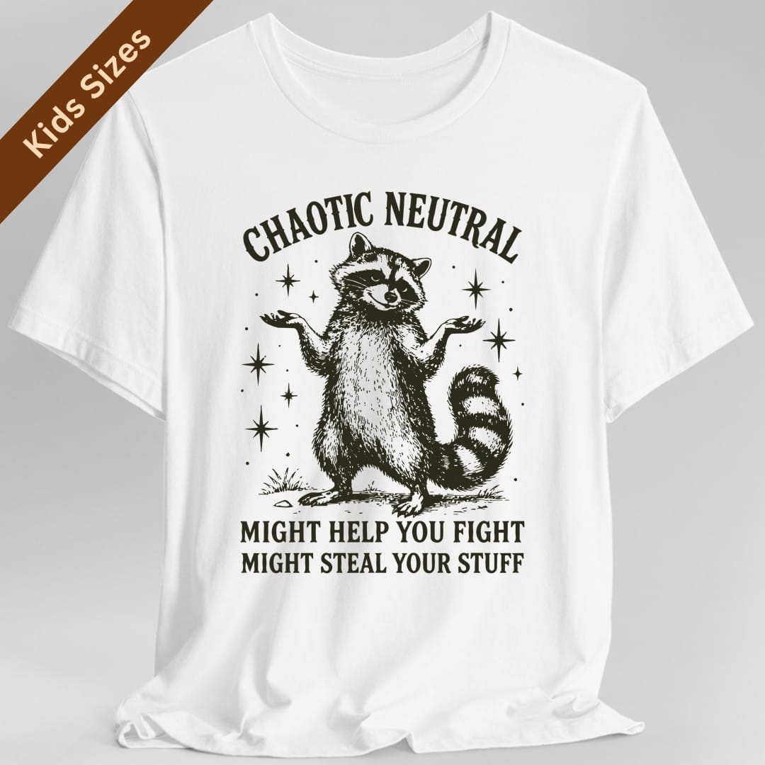 White kids t-shirt. Reads "Chaotic Neutral" curving across the top in dark green capitals. Below, a raccoon stands upright with both paws spread in a shrug, drawn in fine engraving lines and ringed with sparkles. At the bottom, "Might help you fight, might steal your stuff." One dark green ink.
