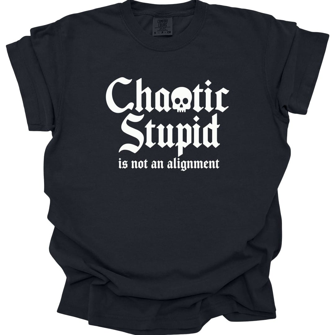 Black t-shirt. Reads "Chaotic Stupid" in large white blackletter script, with a small white skull sitting inside the letter O of Chaotic. Underneath in a smaller italic serif, "is not an alignment." All type, no illustration, in white.