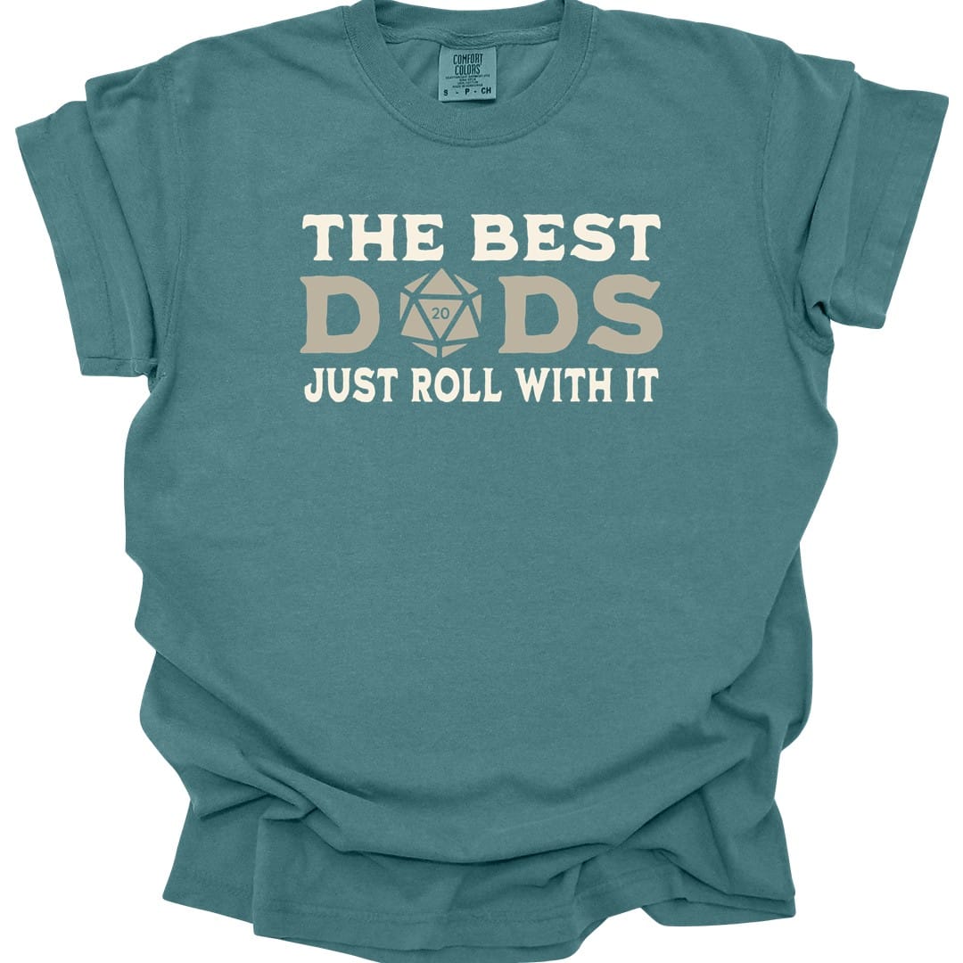 The same Best Dads Just Roll With It design, on a blue spruce t-shirt.