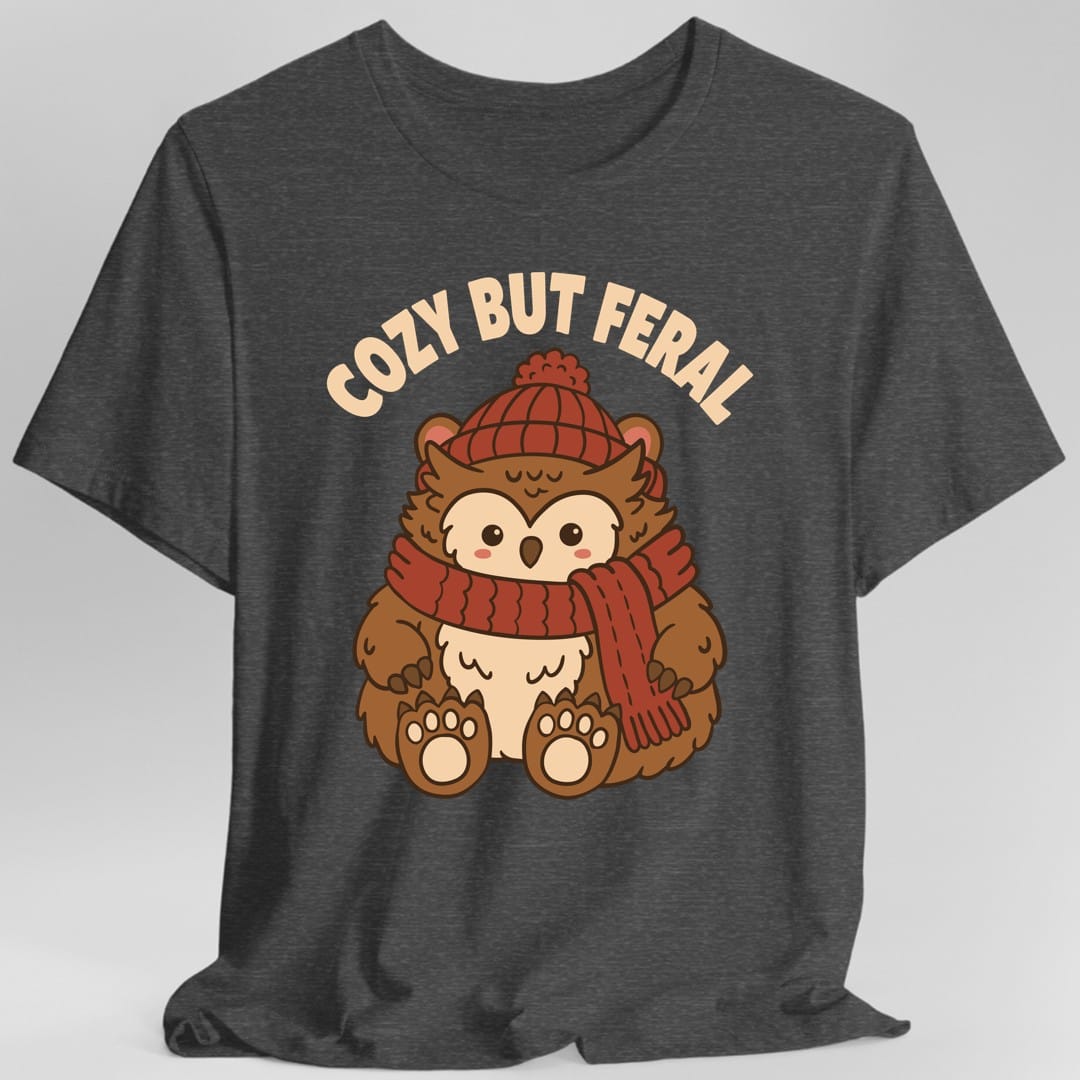 The same Cozy But Feral owlbear design, on a dark heather t-shirt.