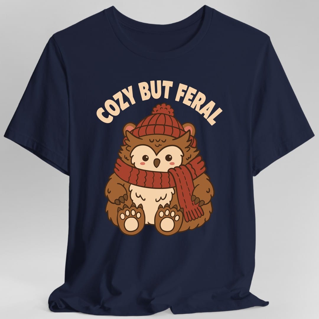 The same Cozy But Feral owlbear design, on a navy t-shirt.