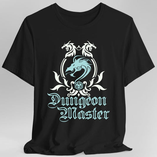 Black t-shirt. A heraldic crest drawn entirely in white with a pale blue dragon on a plain background. Two dragons face each other over an arched frame, a coiled dragon sits inside it, and a twenty-sided die hangs below between leafy flourishes. Underneath, "Dungeon Master" in an ornate blackletter script.