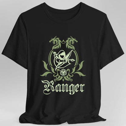 Black t-shirt. A heraldic crest drawn entirely in olive green on a plain background. Two dragons face each other over an arched frame, an archer drawing a bow sits inside the arch, and a twenty-sided die hangs below it between leafy flourishes. Underneath, "Ranger" in an ornate blackletter script.