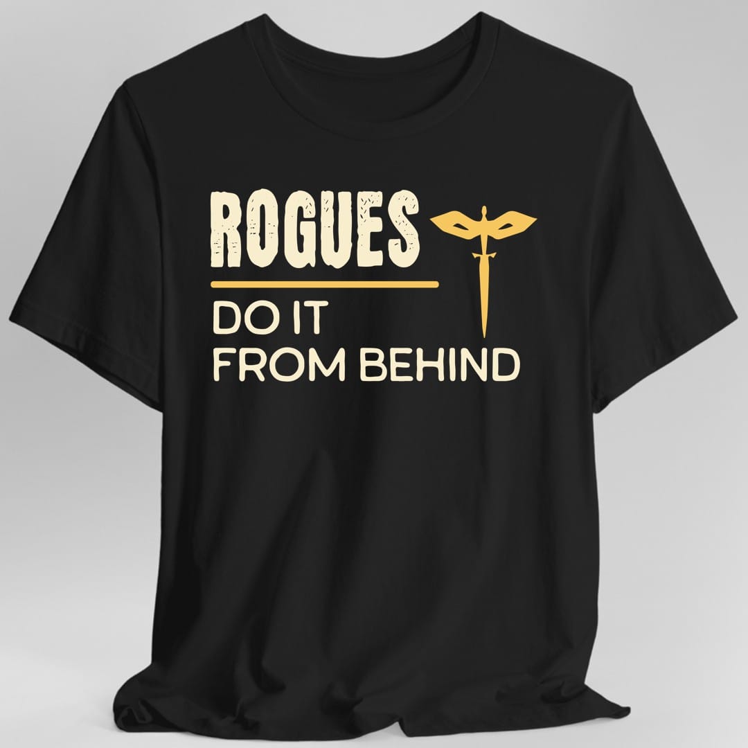 Black t-shirt. Reads "Rogues" across the top in tall cream capitals with a rough distressed texture, a gold rule underneath, then "Do it from behind" in cream capitals below. A small gold a winged dagger sits to the right of the text. All type and one small icon, no illustration.