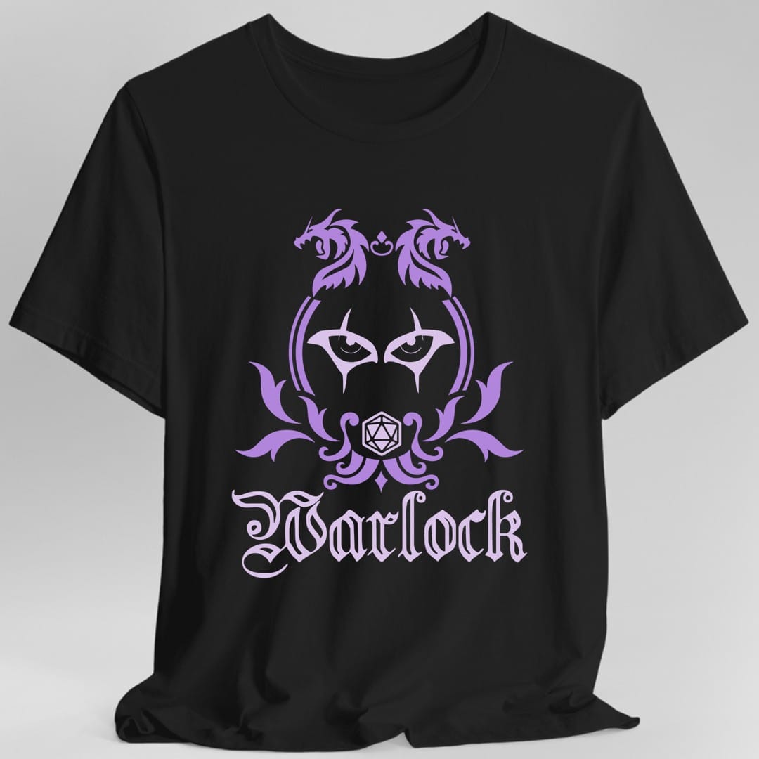 Black t-shirt. A heraldic crest drawn entirely in lavender and violet on a plain background. Two dragons face each other over an arched frame, a pair of watching eyes sits inside the arch, and a twenty-sided die hangs below it between leafy flourishes. Underneath, "Warlock" in an ornate blackletter script.
