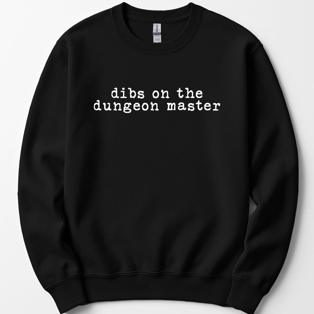 Black sweatshirt. Reads "dibs on the dungeon master" on two lines in plain white lowercase typewriter lettering. Nothing else at all, no illustration, no color, just the words centered on the chest.