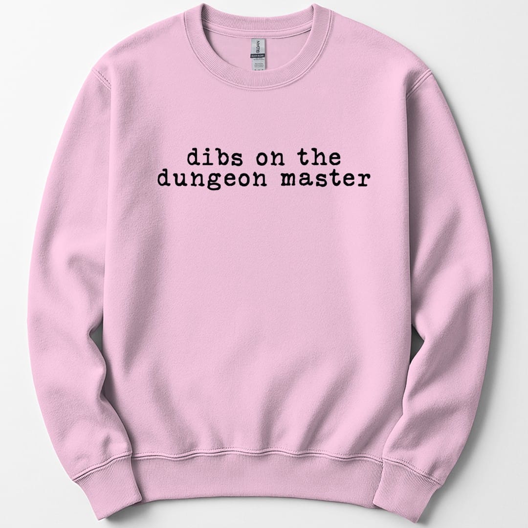 The same Dibs On The Dungeon Master design, on a light pink sweatshirt.