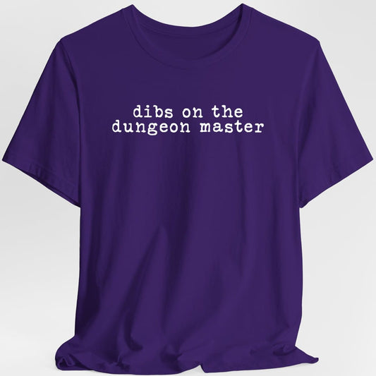The same Dibs On The Dungeon Master design, on a purple t-shirt.