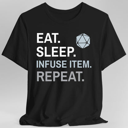 Black t-shirt. Four words stacked in heavy block capitals on four lines: "Eat." and "Sleep." in white, then "Infuse item." in pale blue, then "Repeat." in gray. A pale blue twenty-sided die sits in the top right corner beside the word Eat. All type, no illustration.