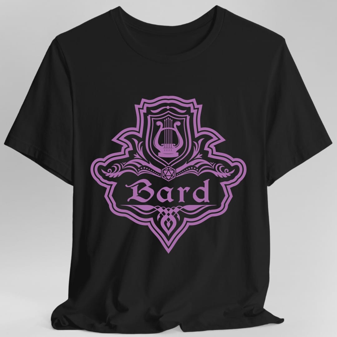 Black t-shirt. A crest shaped like a shield with scalloped edges, drawn entirely in orchid purple with no other color. A small inner shield at the top carries a lyre, an open book with a twenty-sided die on it sits across the middle, and a banner below reads "Bard" in an ornate blackletter script. A pointed pendant hangs from the bottom.