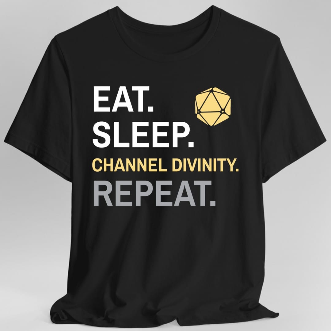 Black t-shirt. Four words stacked in heavy block capitals on four lines: "Eat." and "Sleep." in white, then "Channel divinity." in gold, then "Repeat." in gray. A gold twenty-sided die sits in the top right corner beside the word Eat. All type, no illustration.