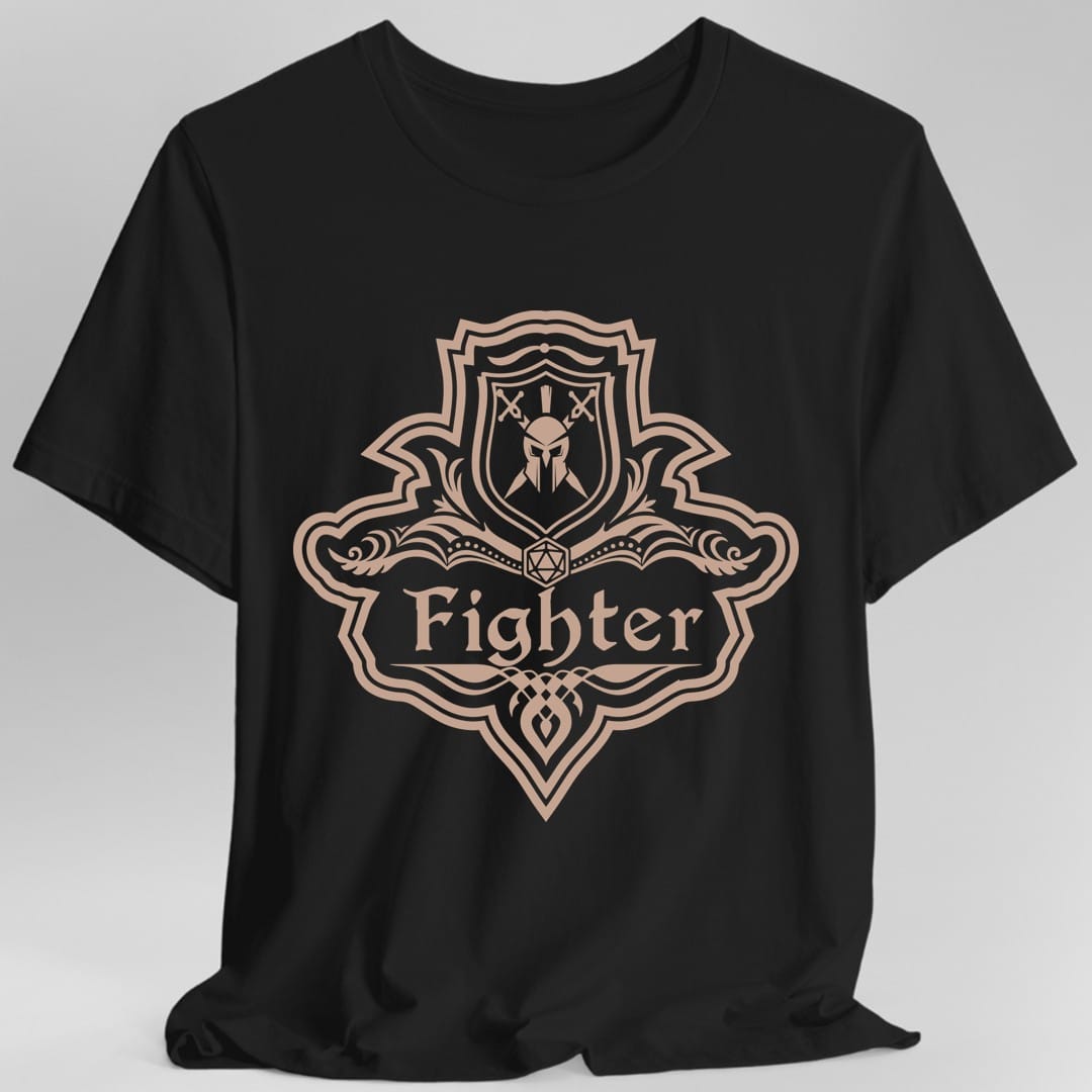 Black t-shirt. A crest shaped like a shield with scalloped edges, drawn entirely in dusty rose with no other color. A small inner shield at the top carries a helm behind crossed swords, an open book with a twenty-sided die on it sits across the middle, and a banner below reads "Fighter" in an ornate blackletter script. A pointed pendant hangs from the bottom.
