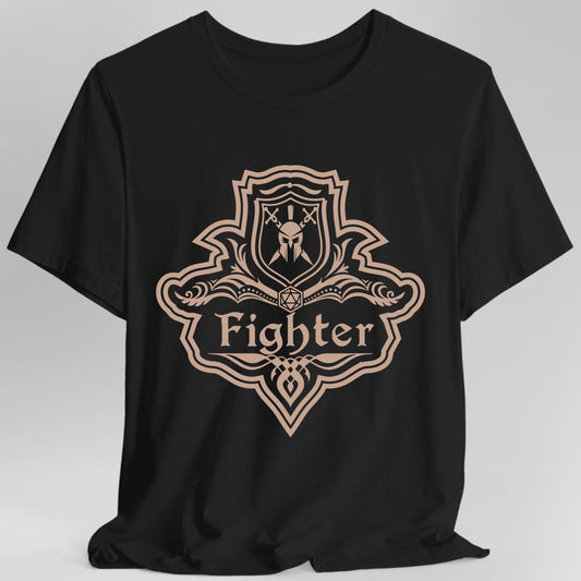 Black t-shirt. A crest shaped like a shield with scalloped edges, drawn entirely in dusty rose with no other colour. A small inner shield at the top carries a helm behind crossed swords, an open book with a twenty-sided die on it sits across the middle, and a banner below reads "Fighter" in an ornate blackletter script. A pointed pendant hangs from the bottom.