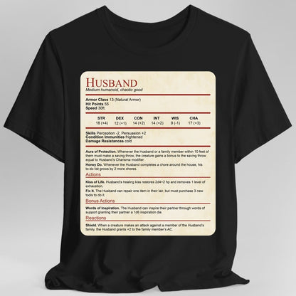 Black t-shirt. Laid out as a Dungeons and Dragons monster stat block on aged parchment, headed "Husband" in dark red with "Medium humanoid, chaotic good" beneath. It lists armor class 13, 55 hit points, speed 30 feet, a full row of ability scores, then Aura of Protection and Honey Do, and actions named Kiss of Life, Fix It, Words of Inspiration and Shield. Dense small text in dark red and black on cream.
