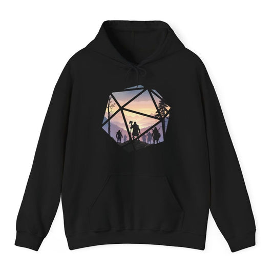 Black hoodie. A large twenty-sided die shape whose triangular facets act as windows onto one continuous landscape. Inside, a party of hooded adventurers in silhouette walks a rocky ridge toward misty violet mountains and a pale gold sunset, a bare tree on the left and pines on the right. The lead figure carries a tall axe. Soft flat illustration in lilac, dusty pink, cream and near black. No words.