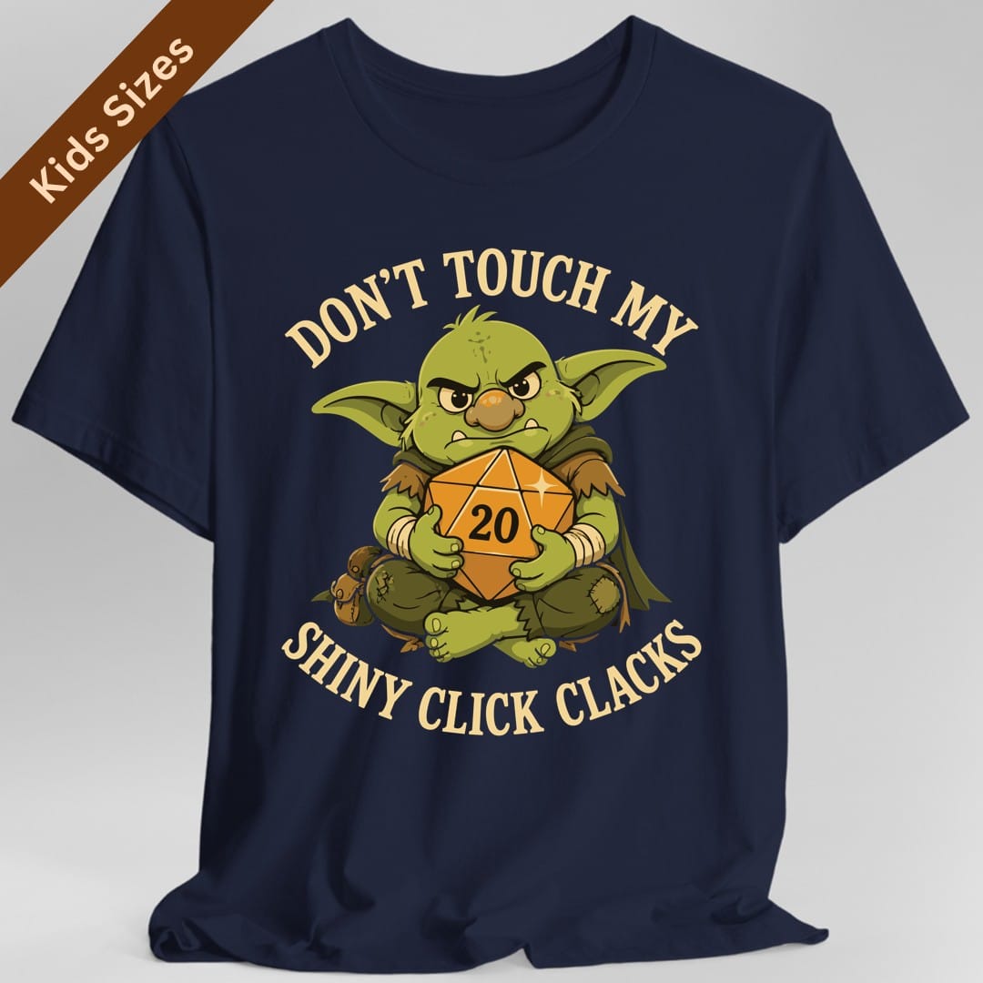 The same Don't Touch My Shiny Click Clacks design, on a navy kids t-shirt.