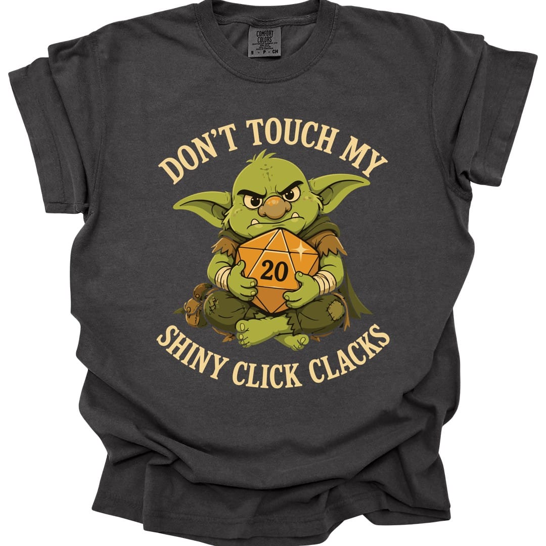The same Don't Touch My Shiny Click Clacks design, on a pepper t-shirt.
