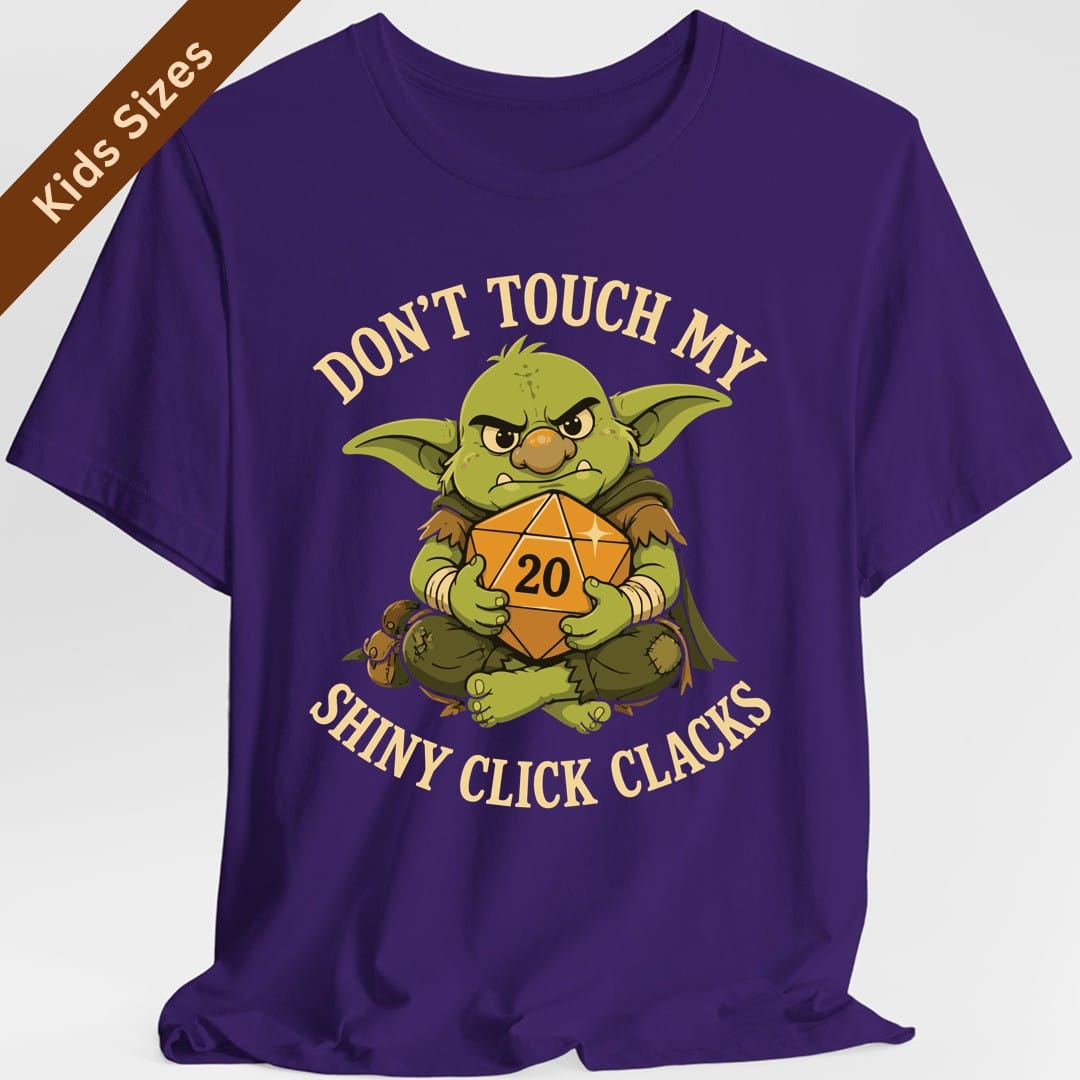 The same Don't Touch My Shiny Click Clacks design, on a purple kids t-shirt.