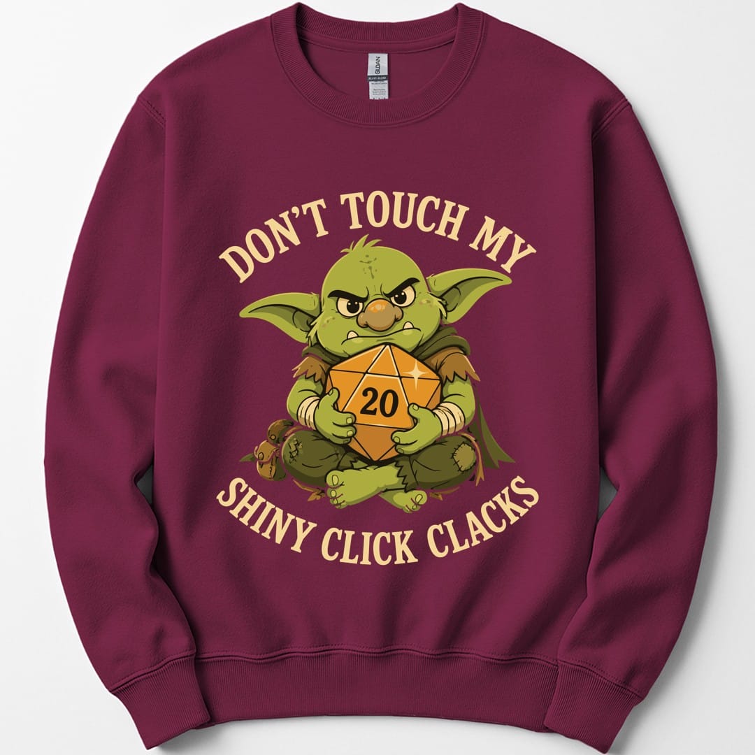 The same Don't Touch My Shiny Click Clacks design, on a maroon sweatshirt.