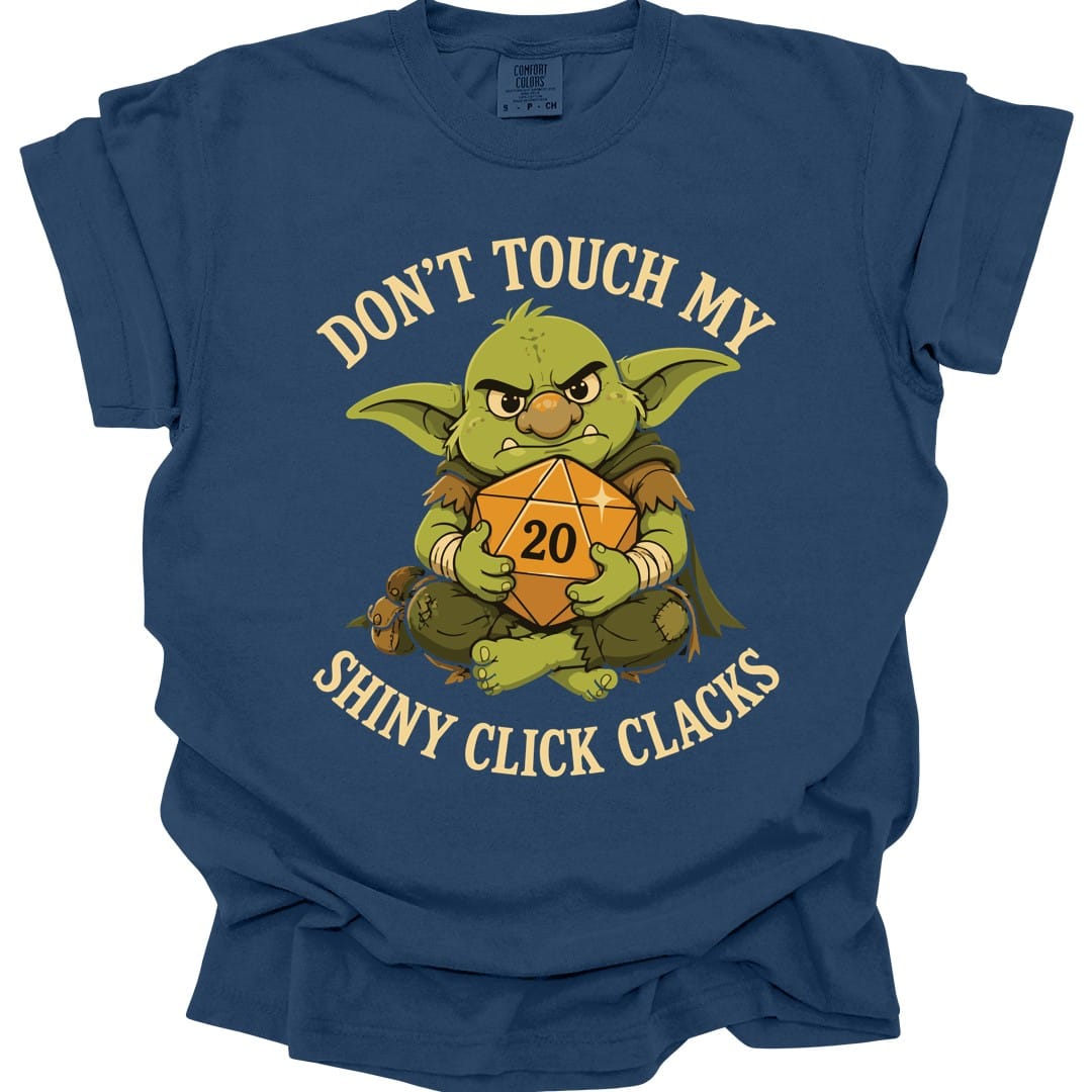 The same Don't Touch My Shiny Click Clacks design, on a true navy t-shirt.