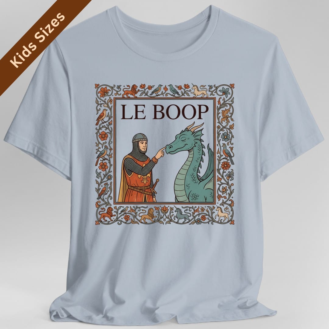 The same Le Boop dragon design, on a light blue kids t-shirt.