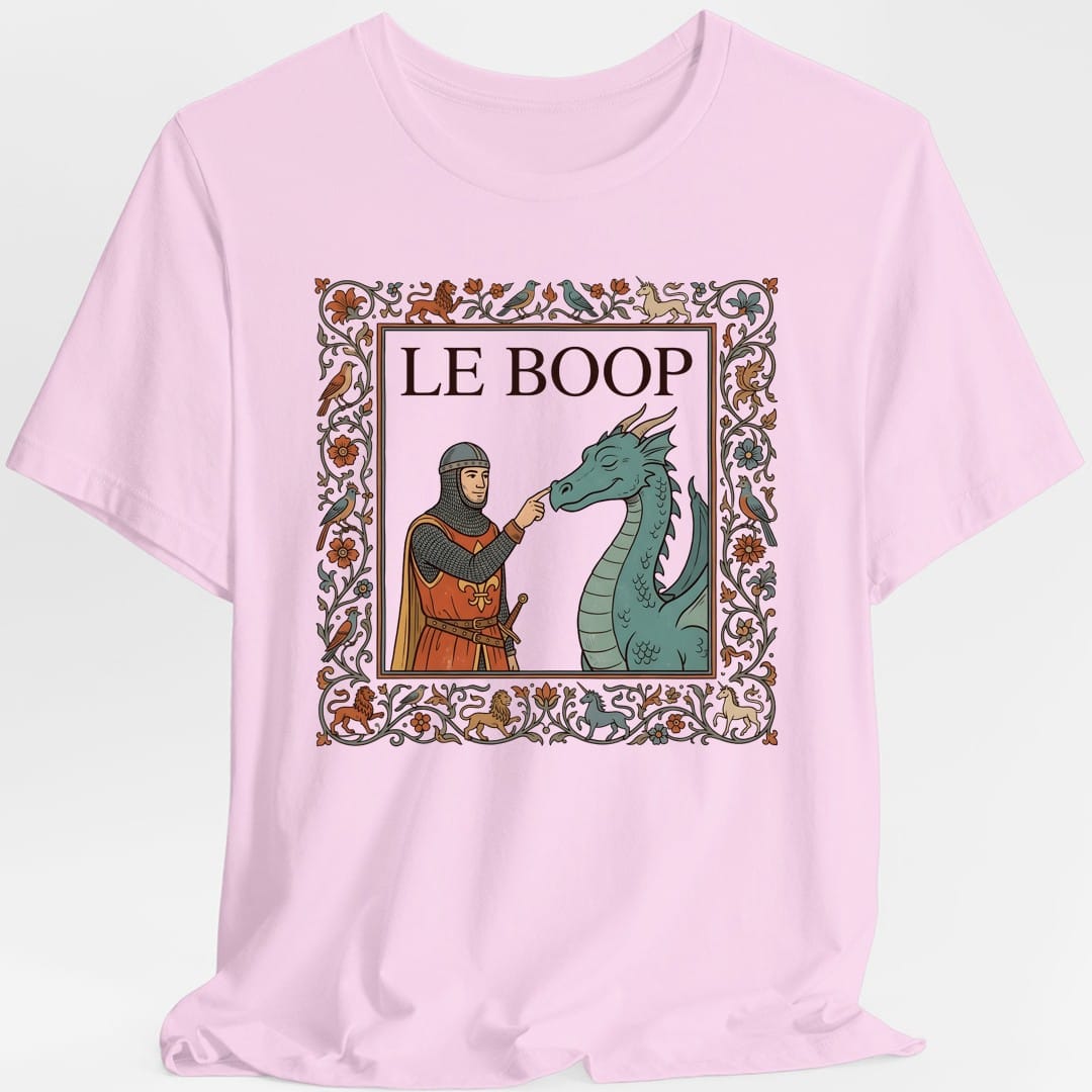 The same Le Boop dragon design, on a light pink t-shirt.
